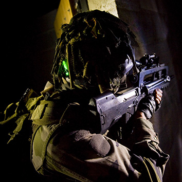 Soldier wearing a helmet with a chemical light on the back