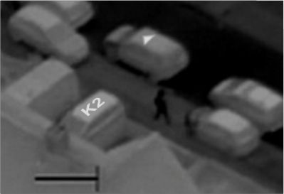 Thermal camera showing thermal identification on 2 vehicles