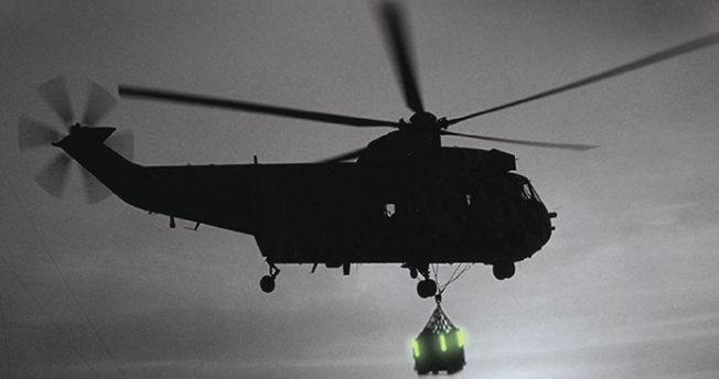 helicopter-with-chemical-lights Helicopter using chemical light on supply drop