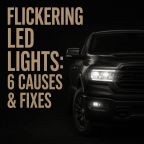Featured image for “Flickering LED Lights: 6 Causes & Fixes” showing a dark pickup truck with headlights