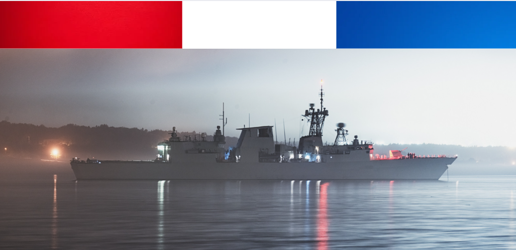 Navy ship with red, white and blue lights